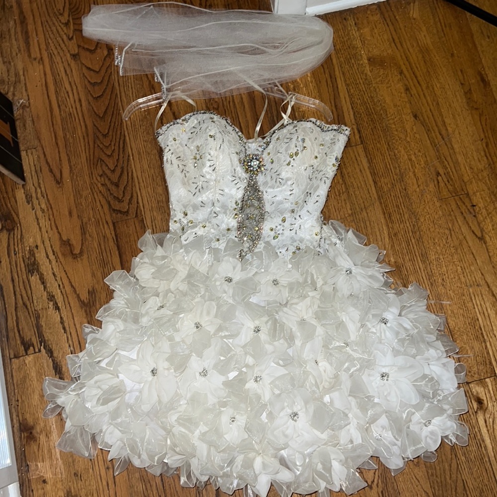 White homecoming dress with flower/bow/feather bottom.